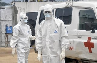 Deploying High-Level Infection Prevention Protocols for Ebola Containment Frontline healthcare workers dressed in full clinical personal protective equipment (PPE) participating f an advanced infection prevention and control training session to manage filovirus outbreaks safely.